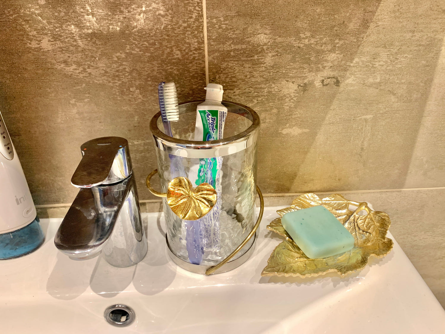 Glass jar with lotus design used in bathroom