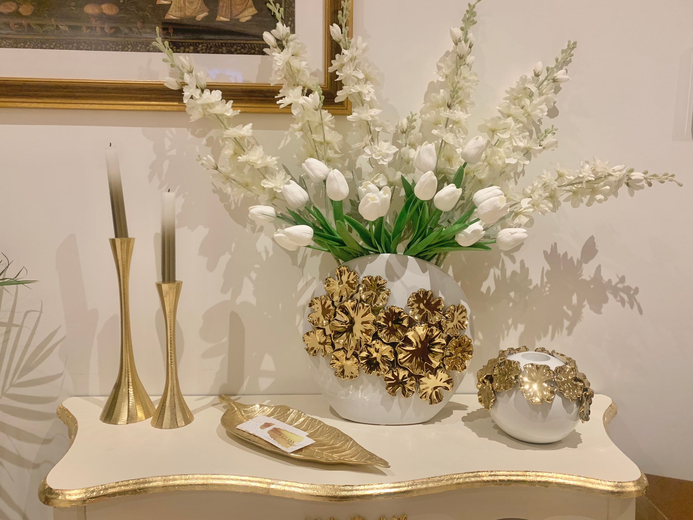 white vases with gold flower design 