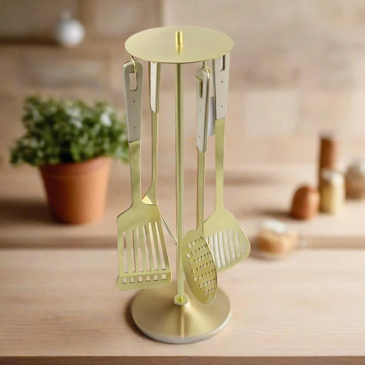 gold kitchen utensils with stand and marble design