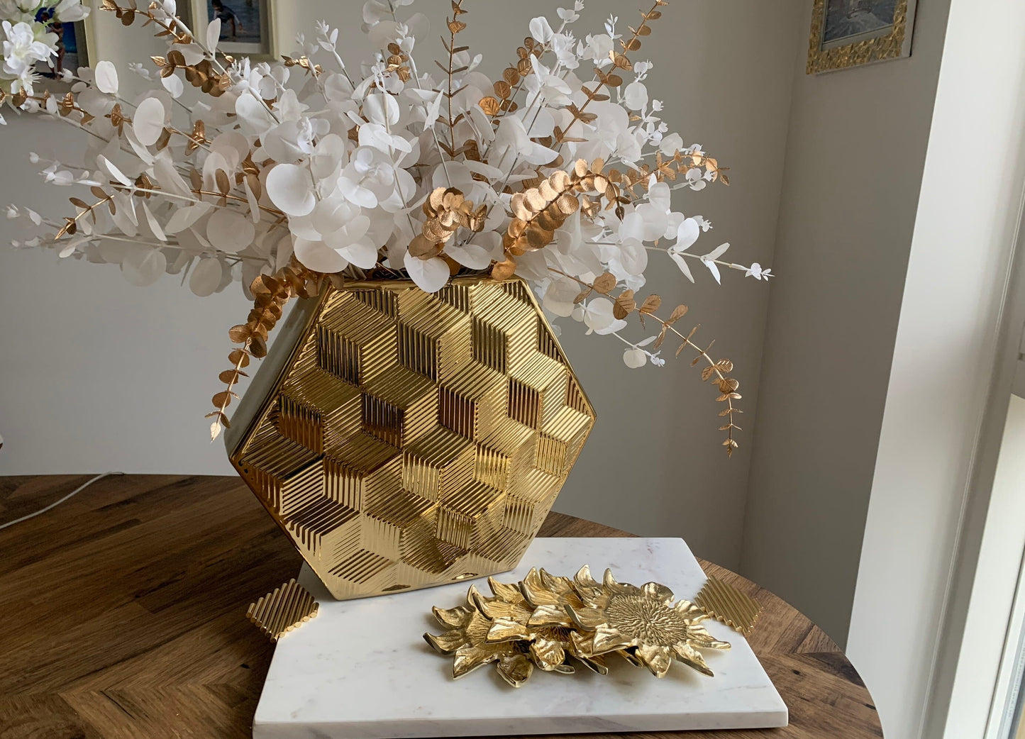 large gold vase with hexagone shape