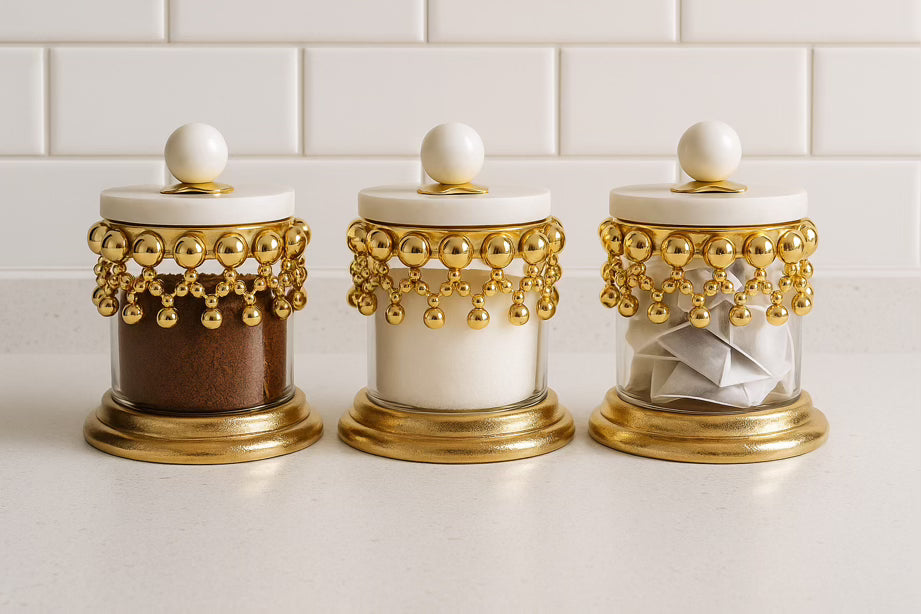 Gold glass canister set with marble lid on kitchen worktop | High Class Touch UK