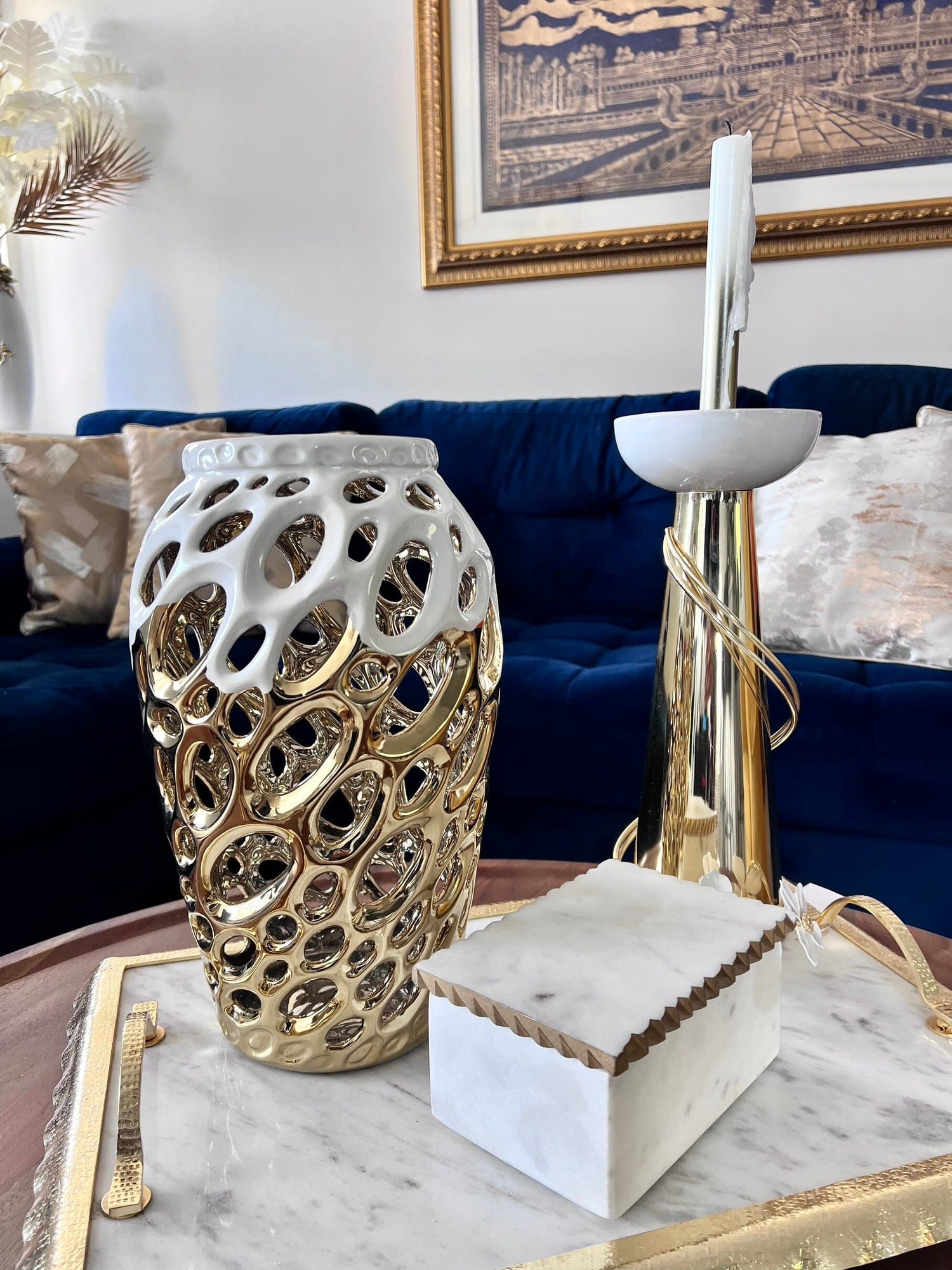 white gold vase for flowers placed on marble tray gold edges home living room