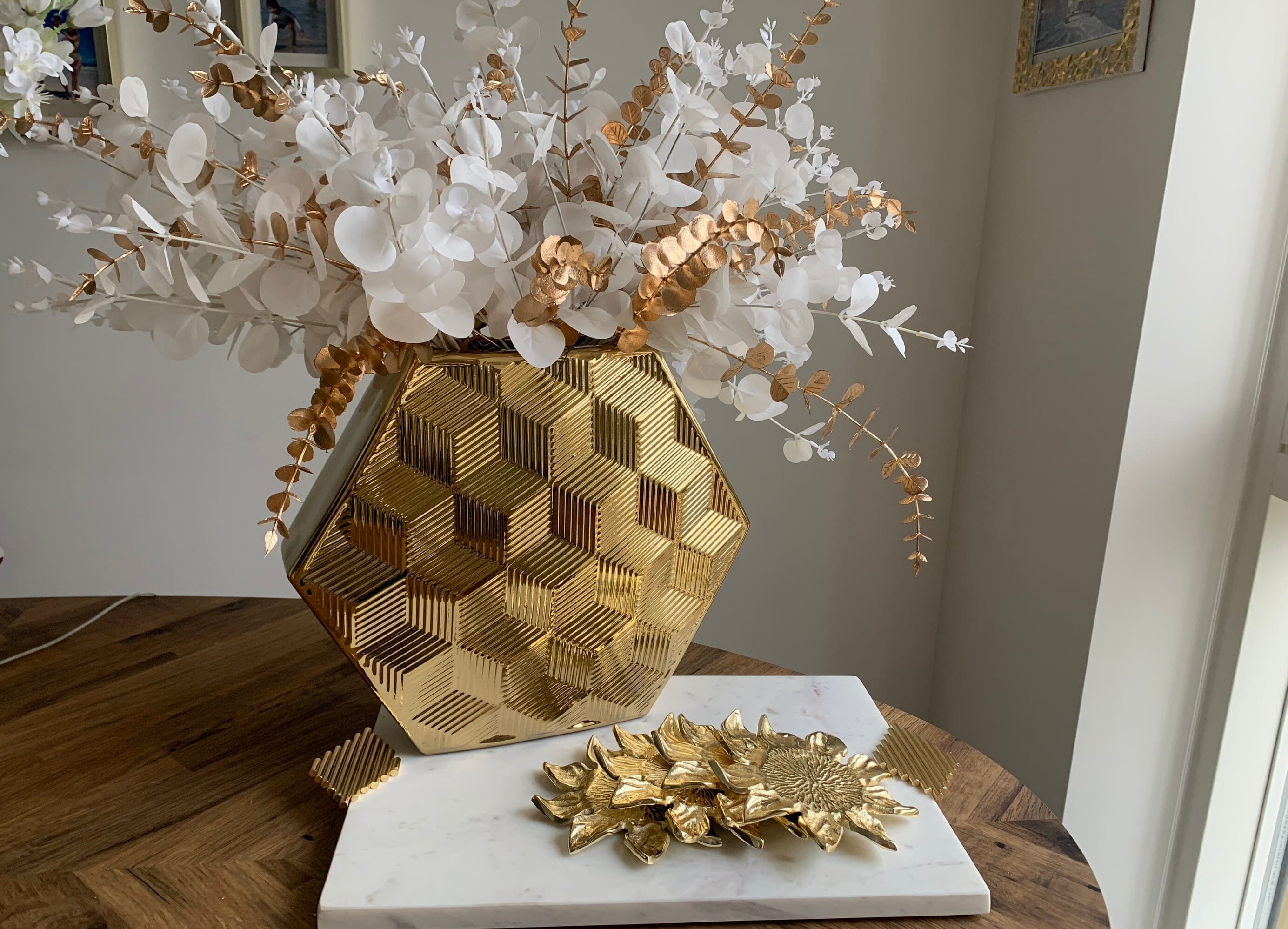 large gold vase with hexagone shape
